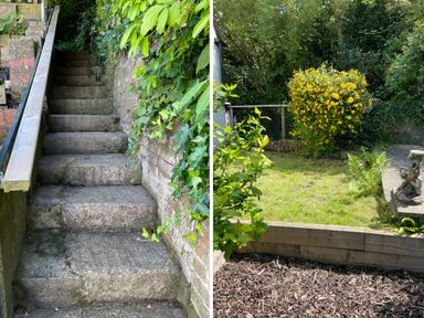 A stone staircase with plants on the side and a garden area with grass and a yellow flowering bush at Tilly's Cottage in Edington