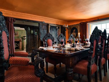 A dining room with a table set and chairs at The Meeting House in Ashburton
