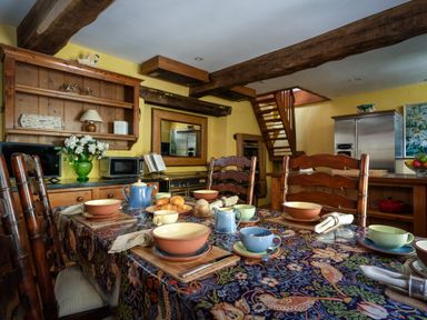 A kitchen with a dining table set for breakfast at The Meeting House in Ashburton