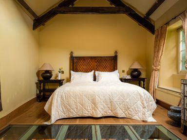 A bedroom with a double bed and nightstands at The Meeting House in Ashburton