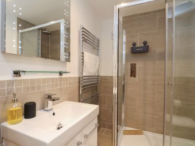 A bathroom featuring a sink, shower, and towel rail at Premier, Transit & Lady Hilda @ Engine Shed, Whitby