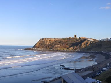 A coastline with waves and cliffs at Cayton Pines in Cayton Bay near Scarborough