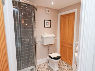 A bathroom with shower and toilet at 20A St Hilda's in Whitby
