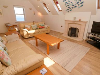 A living room with a coffee table and sofa at Meridian in Carbis Bay