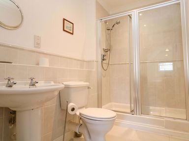 A bathroom with a sink, toilet, and shower at Meridian in Carbis Bay