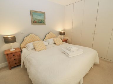 A bedroom with a double bed and nightstands at Keepers Cottage in West Knoyle