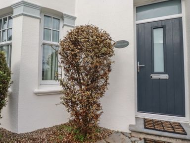 An entrance with a door and windows at Beachcomber in Padstow