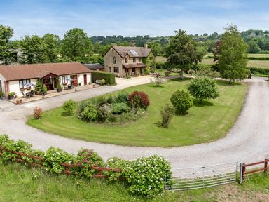 An outdoor view of a house and garden at Little Barn in Cucklington near Wincanton