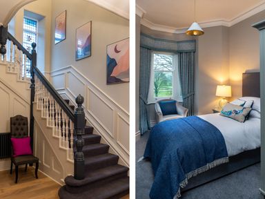 A staircase with stained glass windows and framed artwork next to a bedroom with a single bed blue blanket and a window with curtains at Oakdene Country House in Sedbergh