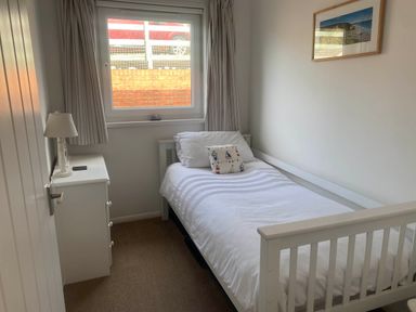 A bedroom with a bed and a window at Valley High in Solva