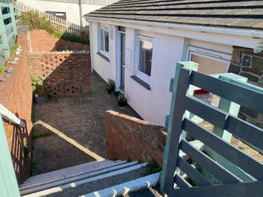 An outdoor area with stairs leading to a house at Valley High in Solva