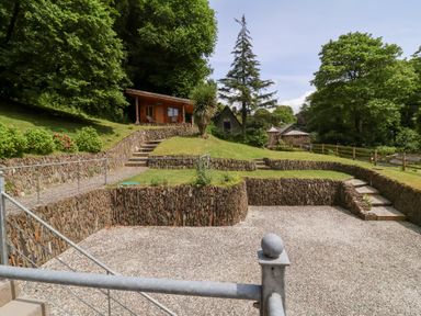 An outdoor area with a cabin and steps at Old Maids Cottage in Woolacombe