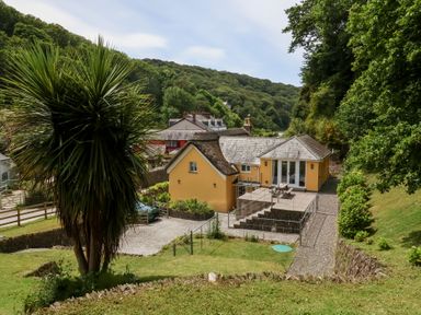 A house with decking and garden at Old Maids Cottage in Woolacombe
