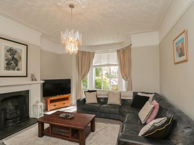 A living room with a sofa and coffee table at Royal Victoria House in Scarborough