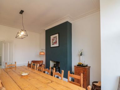 A dining room with a large table and chairs at Royal Victoria House, Scarborough