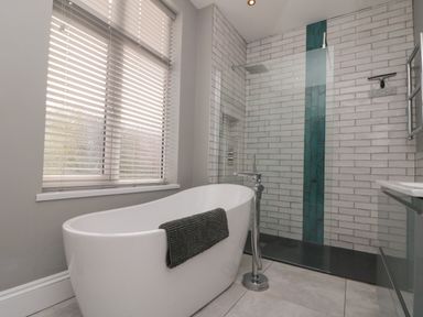 A bathroom with a bathtub and shower at Royal Victoria House Scarborough