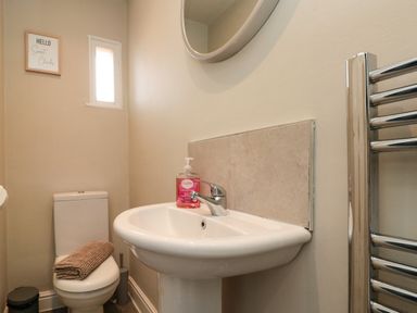 A bathroom with a sink and toilet at Royal Victoria House Scarborough