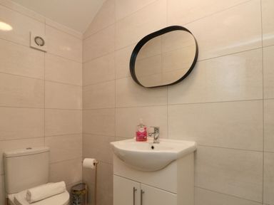 A bathroom with a sink and toilet at Royal Victoria House in Scarborough