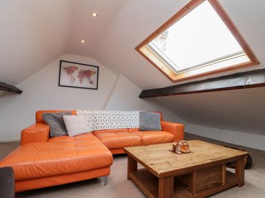 A living room with a sofa and coffee table at Royal Victoria House in Scarborough