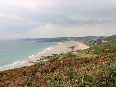 A view of a beach and ocean from a cliff at Stargazy Cottage Praa Sands
