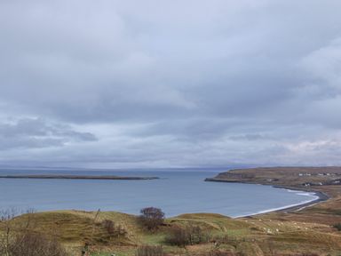 A coastal landscape with a bay hills and scattered houses at Garraidh Ghorm Pod in Conista