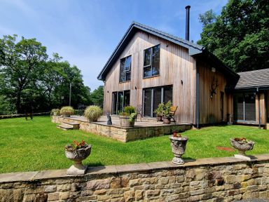 A house with a patio and garden at Romsey Lodge in Wark