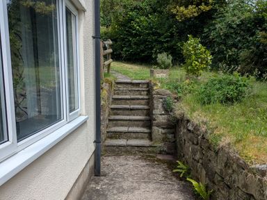 Steps leading to a garden area at Pool House The Narth near Trellech