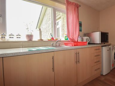 A kitchen with sink and appliances at Underlanes in Boscastle