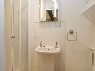 A bathroom with a sink and a mirror above at Hillcrest in Scarborough