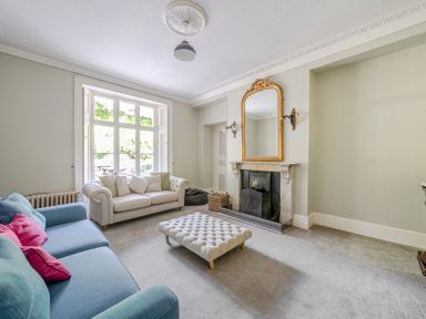 A living room with a sofa and coffee table at Milton Manor in Milton On Stour