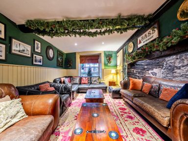A living room with sofas and a coffee table at The Boars Head Pub in Bishop's Castle