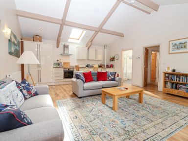 A living room with a sofa and coffee table at Tregona Buckland Monachorum near Yelverton