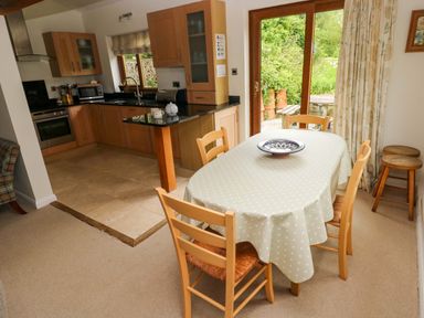 A kitchen with a dining area at Brynawelon in Newport, Pembrokeshire