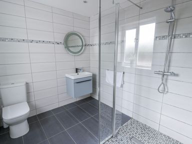 A bathroom with shower and sink at Y Felin in Cardigan, Ceredigion