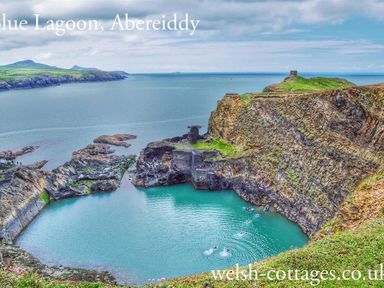 A coastal lagoon with rocky cliffs and swimmers in the water at The Old Farmhouse Kitchen in St Davids Pembrokeshire