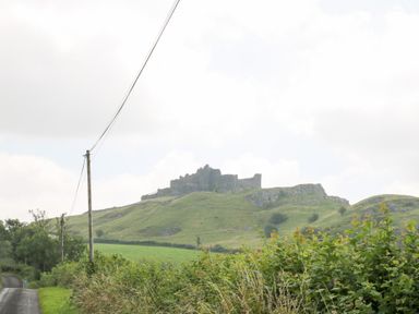 A castle on a hill visible from a road at Dan Castell Cottage in Llandeilo, Carmarthenshire