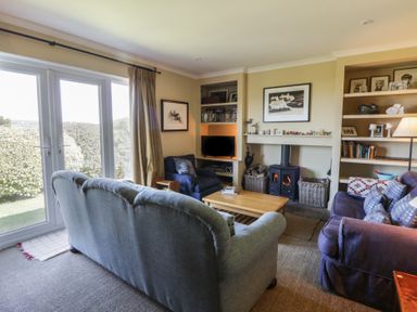 A living room with a coffee table and sofa at Dolwylan in Newport, Pembrokeshire