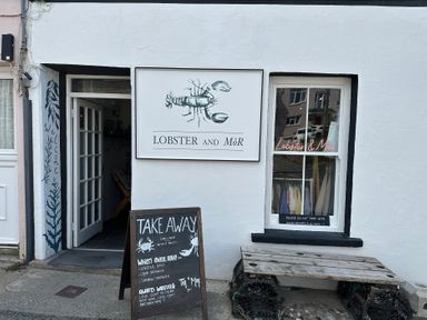 An outdoor view of a restaurant called Lobster and Môr in Little Haven, Pembrokeshire