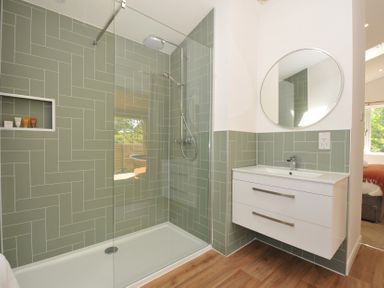 A bathroom with a shower and sink at The Hideout in Lanreath