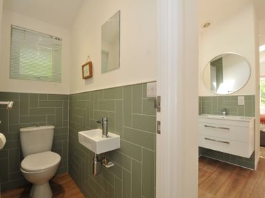 A bathroom with a sink and toilet at The Hideout in Lanreath
