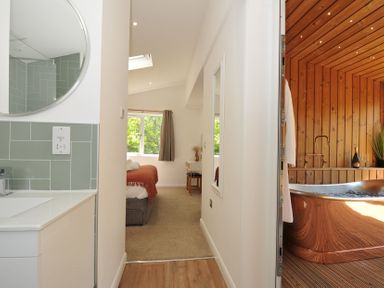 A bathroom leading to a bedroom and bathtub at The Hideout in Lanreath