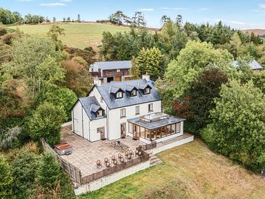 A house with patio and hot tub at Barn Owl Lodge in Rhayader
