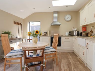 A kitchen with a table and chairs at 1 Church Barns Pocklington