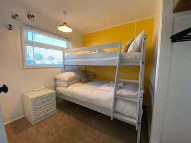 A bedroom with a bunk bed and a nightstand at 246 California Road, California, Norfolk