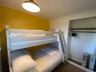 A bedroom with bunk beds and a storage area at 246 California Road California, Norfolk