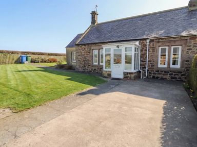 A house with a garden and pathway at The Retreat in Embleton