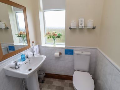 A bathroom with a sink and toilet at The Retreat in Embleton