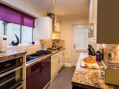 A kitchen with countertop appliances and food on the counter at Heathfield in Keswick