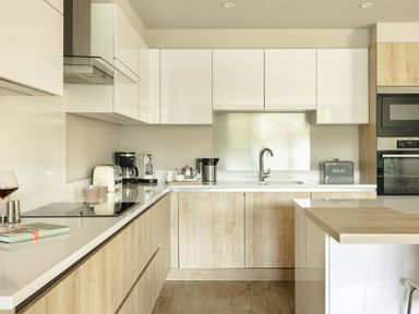 A kitchen with appliances and cabinets at Take Five in Ambleside