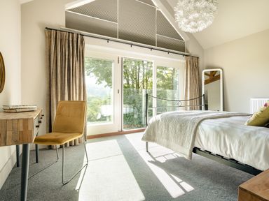 A bedroom with a bed and desk at Take Five in Ambleside